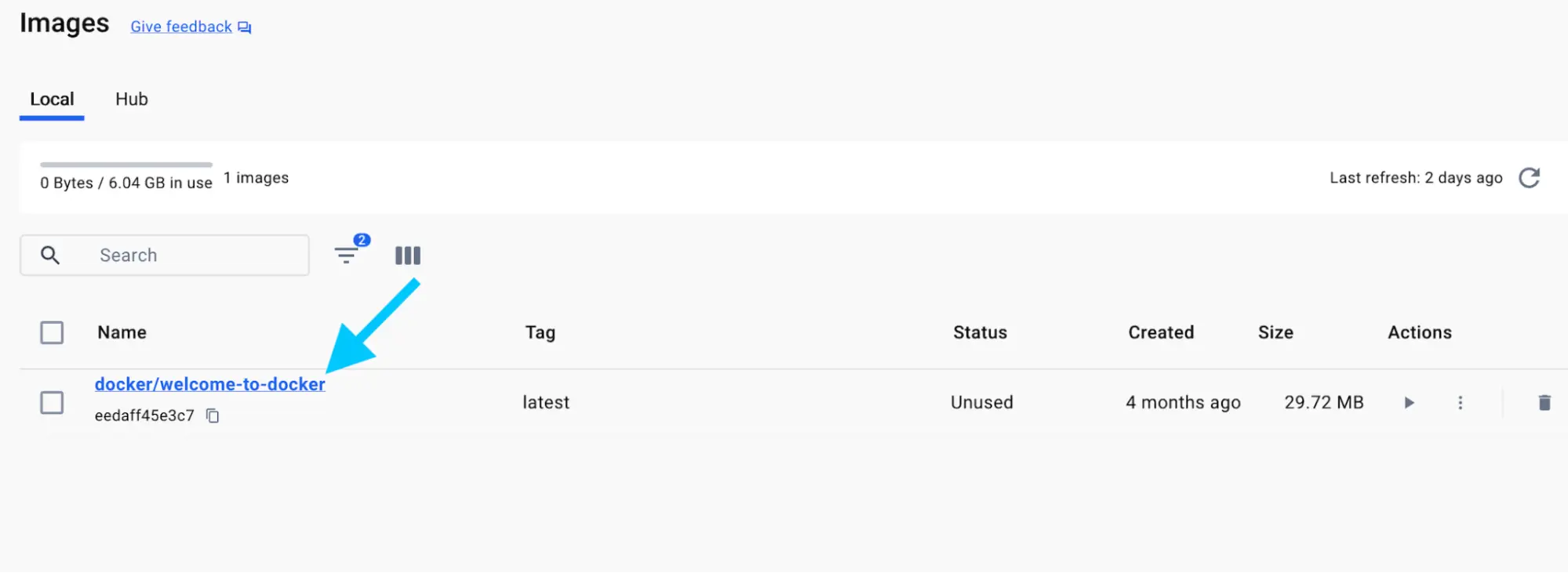 Docker 仪表板的屏幕截图，显示图像视图，其中箭头指向 docker/welcome-to-docker 图像